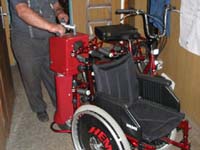 Části karosérie tlačného zařízení invalidního vozíku